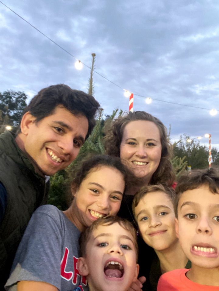 Luis and Sarah Ortiz with their four children.