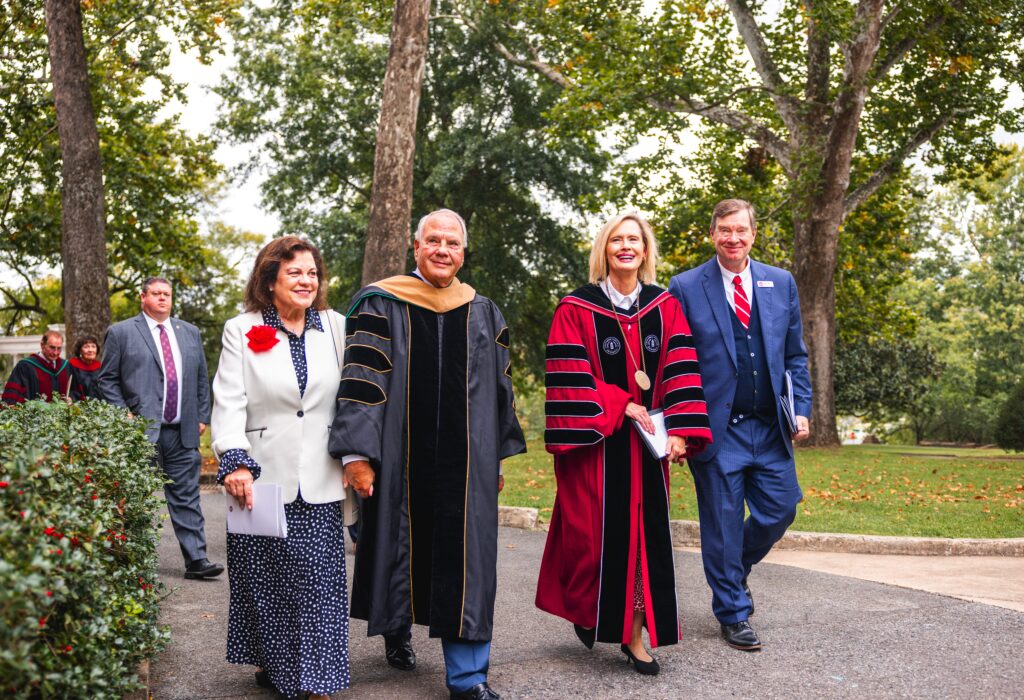 Elder Ronald A. Rasband of the Quorum of the Twelve Apostles of The Church of Jesus Christ of Latter-day Saints and his wife, Melanie, walk with President Bonnie H. Cordon and her husband Derek Cordon during Cordon's inauguration ceremony at SVU in Buena Vista, Va., Sept. 13, 2024.